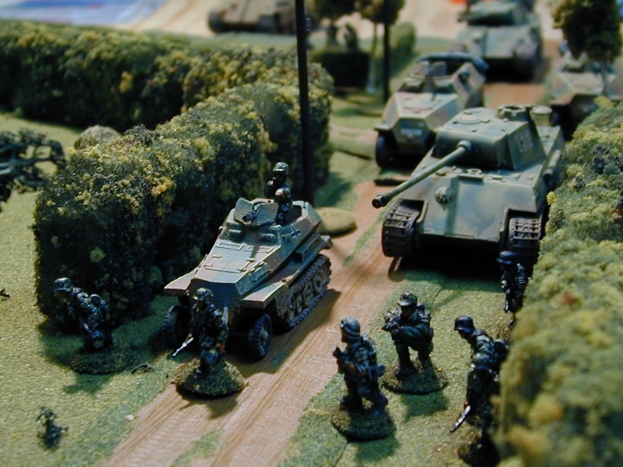 German Panzer Grenadiers screen the advancing armor.